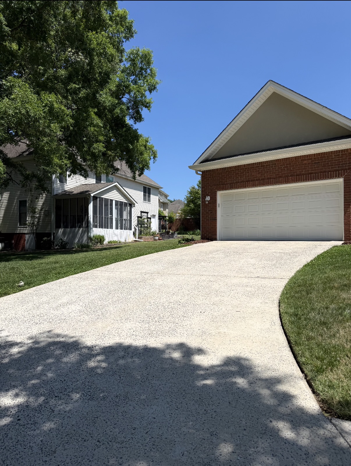 Clean residential driveway after pressure washing